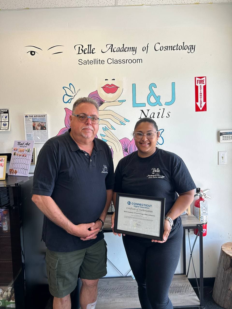 Belle Academy nails classroom graduate with instructor
